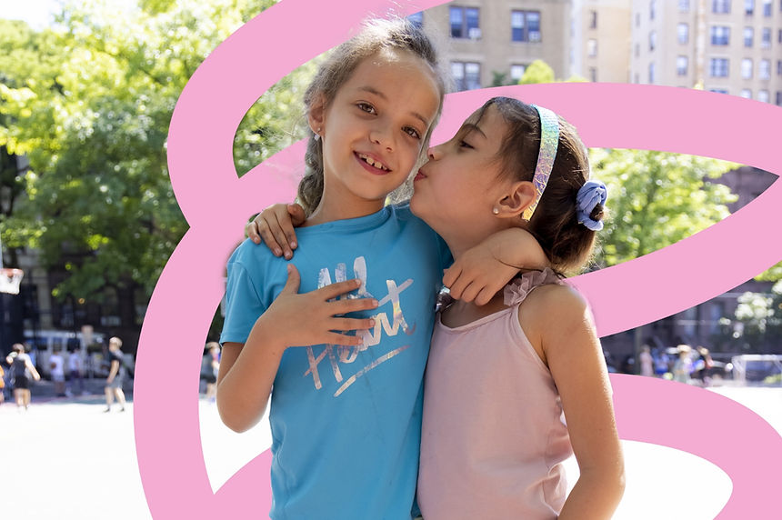 2 young girls embracing
